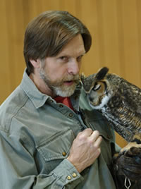 Jack Hubley whispers to his owl.